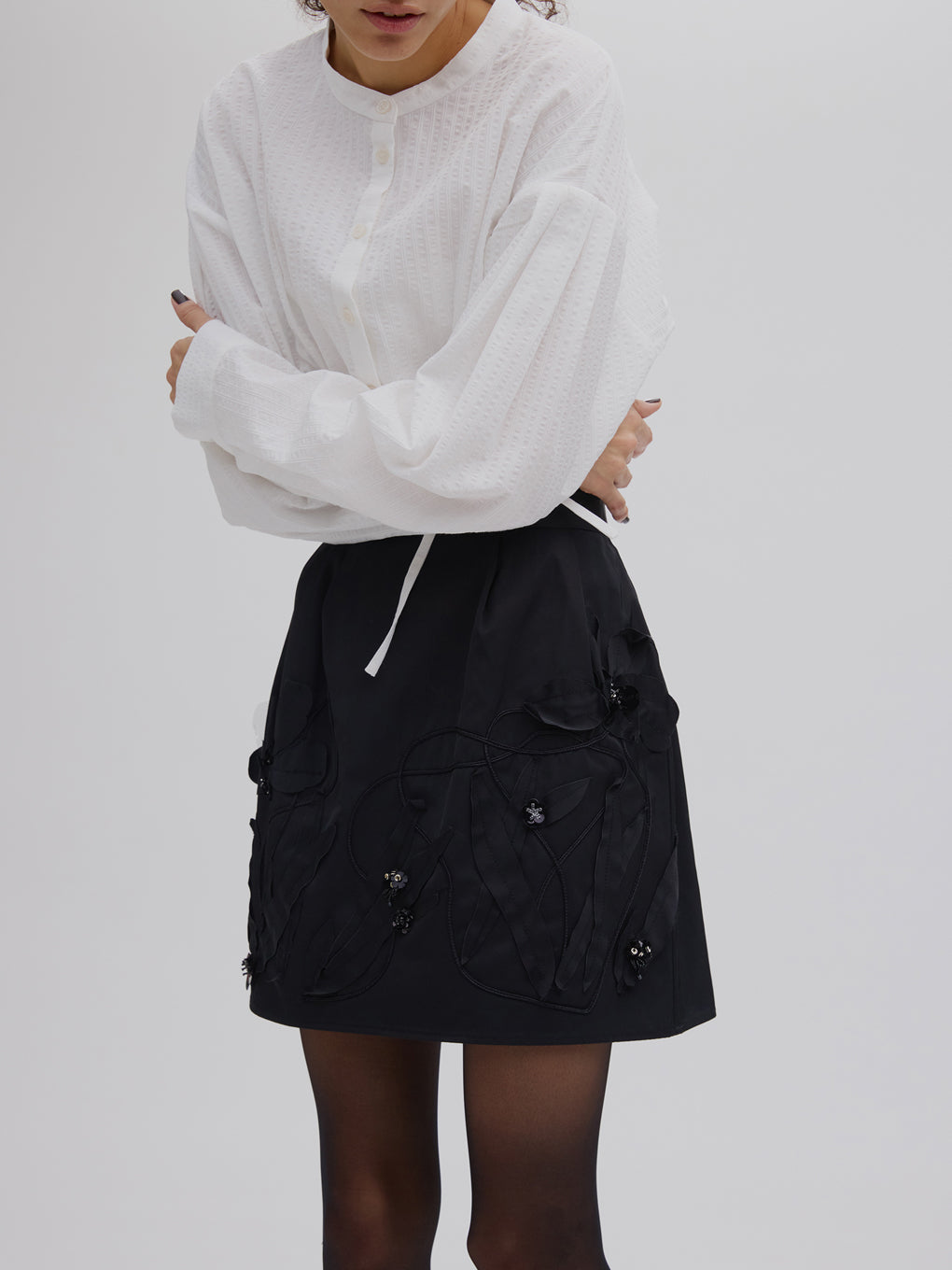 UND FLOUR MOTIF MINI SKIRT