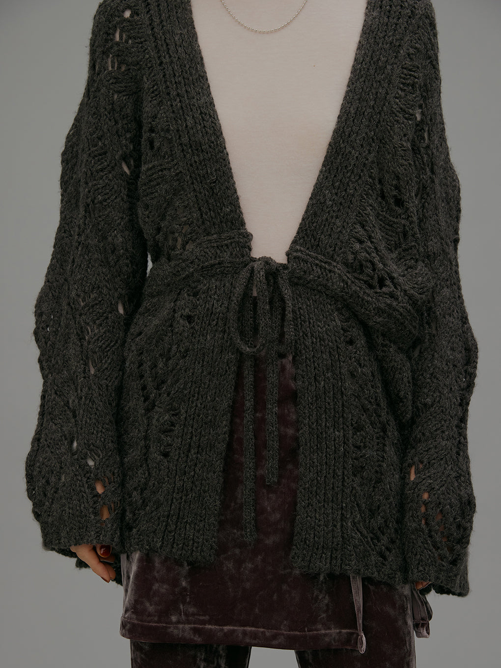 UND LOOSE CABLE KNIT CARDIGAN