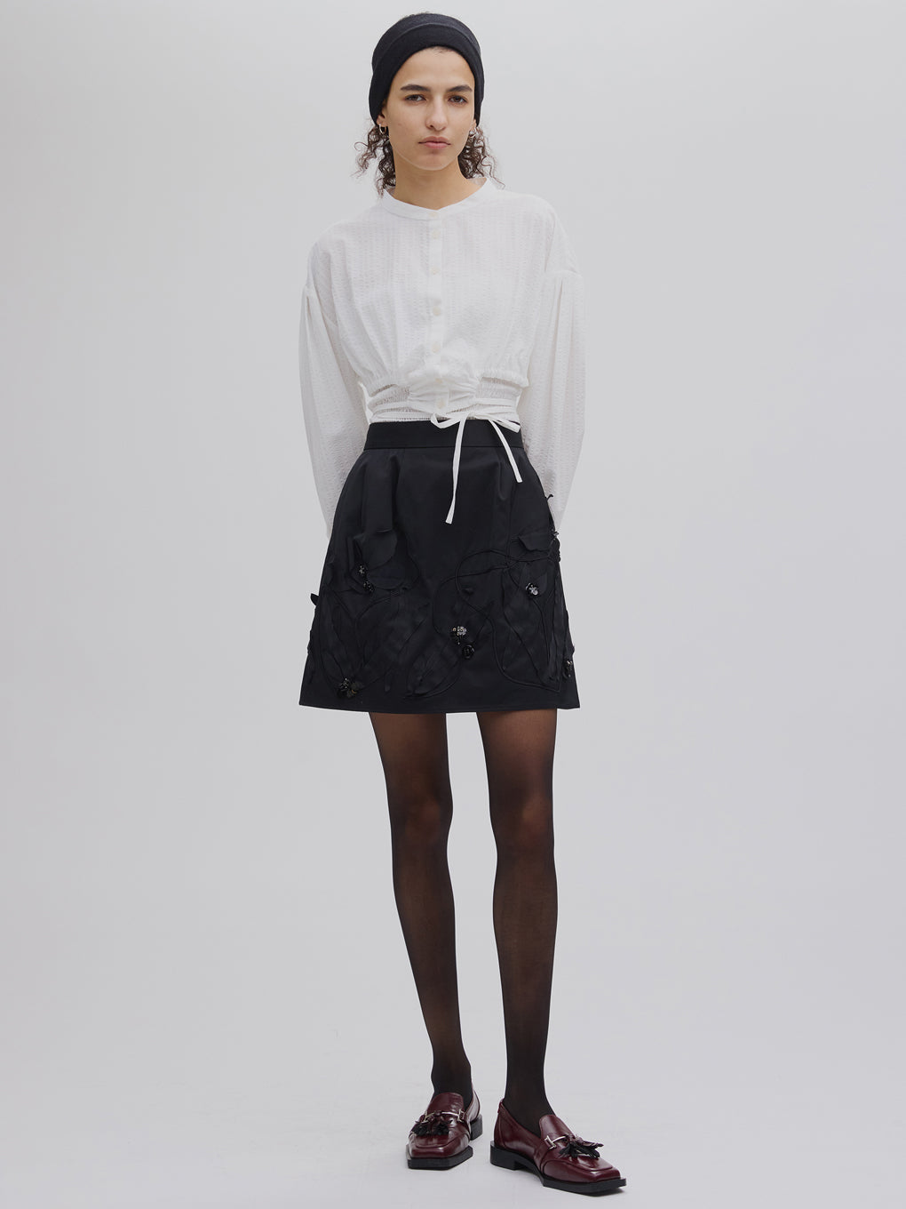 UND FLOUR MOTIF MINI SKIRT