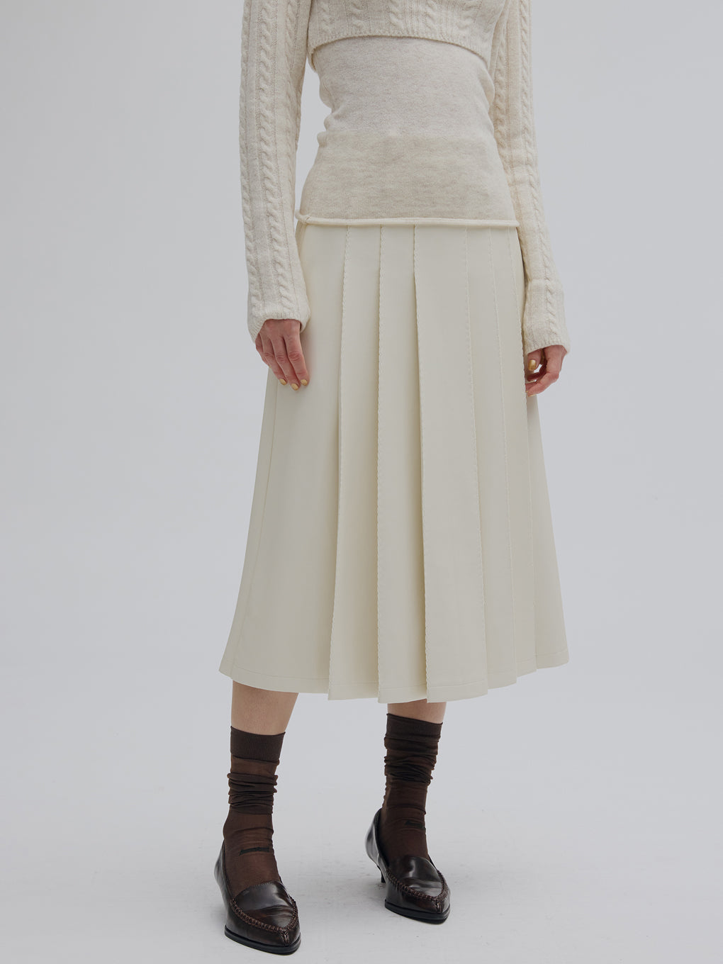 PLEATS MEDIUM SYNTHETIC LEATHER SKIRT