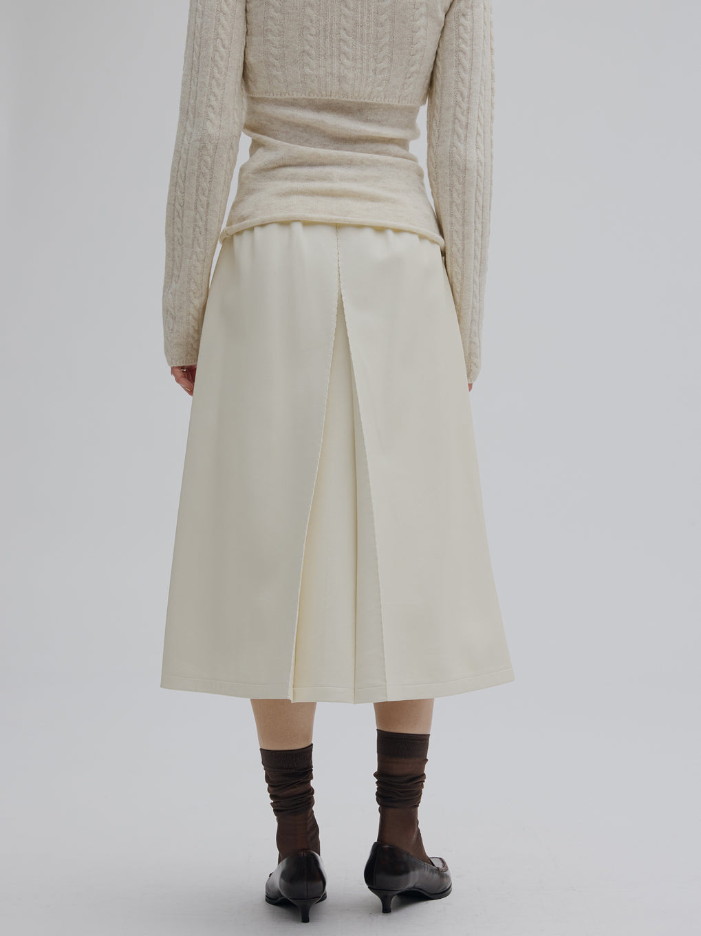 PLEATS MEDIUM SYNTHETIC LEATHER SKIRT